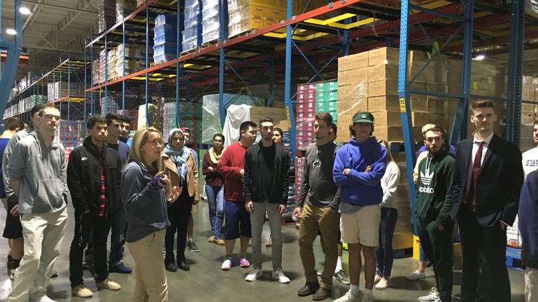 group of students touring warehouse
